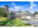 Well-manicured lawn and landscaping highlight this home's attractive exterior elevation and curb appeal at 6965 Us-401, Fuquay Varina, NC 27526