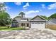 Charming home with a two-car garage, nicely landscaped yard, and a beautiful cloudscape above at 6965 Us-401, Fuquay Varina, NC 27526