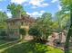 Expansive backyard with mature trees, patio, and well-maintained landscaping at 1015 Minerva Ave, Durham, NC 27701