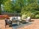 Cozy brick patio with comfortable seating, perfect for outdoor relaxation and entertaining at 1015 Minerva Ave, Durham, NC 27701