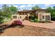 Stunning backyard featuring a brick patio and manicured landscaping and garden at 1015 Minerva Ave, Durham, NC 27701