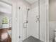 Modern bathroom featuring a glass-enclosed shower with sleek fixtures and classic white tile at 1015 Minerva Ave, Durham, NC 27701