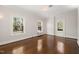 Sunny bedroom featuring refinished wood floors, fresh white paint and classic trim at 1015 Minerva Ave, Durham, NC 27701