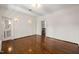 Spacious bedroom features hardwood floors and a bright, neutral color scheme at 1015 Minerva Ave, Durham, NC 27701