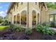 Inviting covered porch with elegant columns and a peaceful garden view at 1015 Minerva Ave, Durham, NC 27701