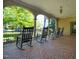 Relaxing covered porch with rocking chairs and tiled flooring, perfect for enjoying the outdoors at 1015 Minerva Ave, Durham, NC 27701
