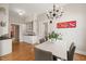 Charming dining area with white table, gray chairs, and a built-in hutch, offering a cozy atmosphere at 1015 Minerva Ave, Durham, NC 27701