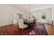 Traditional dining room with hardwood floors, chandelier, and elegant wainscoting at 1015 Minerva Ave, Durham, NC 27701