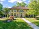 Stately home with a tile roof, lush lawn, and meticulously landscaped front yard at 1015 Minerva Ave, Durham, NC 27701
