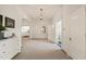 Spacious foyer offers an open layout with an archway into a living room and doors to a bathroom at 1015 Minerva Ave, Durham, NC 27701