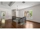 Foyer featuring wood floors, natural light, and an open staircase at 1015 Minerva Ave, Durham, NC 27701