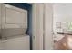 A functional laundry area with a stacked washer and dryer, maximizing space efficiency at 1015 Minerva Ave, Durham, NC 27701
