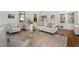 Sun-filled living room features a neutral palette, hardwood floors, and ample seating at 1015 Minerva Ave, Durham, NC 27701