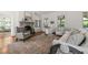 Elegant living room boasts a fireplace, windows, and comfortable seating arrangement at 1015 Minerva Ave, Durham, NC 27701