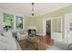 Bright living room with large windows, fireplace, and classic decor, creating a cozy and inviting atmosphere at 1015 Minerva Ave, Durham, NC 27701