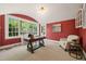 Office space featuring natural light, a large window, and a wooden desk at 1015 Minerva Ave, Durham, NC 27701
