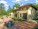 Backyard featuring a brick patio with outdoor seating and lush landscaping at 1015 Minerva Ave, Durham, NC 27701