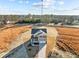 Aerial shot of a two-story home with a manicured lawn and long driveway at 15 Diamond Creek Dr, Zebulon, NC 27597