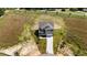 Aerial view of a two-story home with a long driveway and green lawn at 15 Diamond Creek Dr, Zebulon, NC 27597