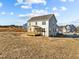 View of the backyard featuring a wood porch and expansive outdoor space at 15 Diamond Creek Dr, Zebulon, NC 27597