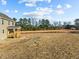 Expansive lot with a wooden porch overlooking a tranquil backyard at 15 Diamond Creek Dr, Zebulon, NC 27597