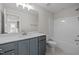 Bathroom features a vanity, sink, a framed mirror, a toilet, and a shower with a bathtub combo at 15 Diamond Creek Dr, Zebulon, NC 27597