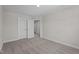 Neutral bedroom featuring carpet floors, a ceiling light, and white doors with chrome knobs at 15 Diamond Creek Dr, Zebulon, NC 27597