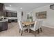 Inviting dining area with a large wooden table, seating for six, and an open view into the kitchen at 15 Diamond Creek Dr, Zebulon, NC 27597