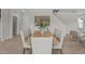 Inviting dining area with a large wooden table, seating for six, and an open view into the kitchen at 15 Diamond Creek Dr, Zebulon, NC 27597
