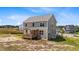 Back of a two-story house with a covered back porch at 15 Diamond Creek Dr, Zebulon, NC 27597