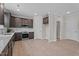 Modern kitchen featuring stainless steel appliances, dark wood cabinets, and white subway tile backsplash at 15 Diamond Creek Dr, Zebulon, NC 27597