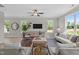 Cozy living room with comfortable seating, modern decor, and lots of natural light from the windows at 15 Diamond Creek Dr, Zebulon, NC 27597