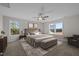 Serene bedroom with soft lighting, a plush bed, and views of the outdoor scenery at 15 Diamond Creek Dr, Zebulon, NC 27597