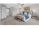 Comfortable main bedroom featuring a king-size bed, neutral colors, ceiling fan, and a window for natural light at 15 Diamond Creek Dr, Zebulon, NC 27597