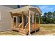 Back porch featuring wood columns, wood railings, and wood steps at 15 Diamond Creek Dr, Zebulon, NC 27597