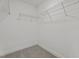 Empty walk-in closet with wire shelves ready for organization at 15 Diamond Creek Dr, Zebulon, NC 27597