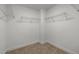 Empty walk-in closet with wire shelving and plush carpet at 15 Diamond Creek Dr, Zebulon, NC 27597