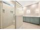 Bathroom featuring tiled shower with bench and modern vanity with cabinets at 205 Purslane Dr, Franklinton, NC 27525