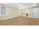 A bright bedroom with a ceiling fan and doorway leading to the bathroom at 205 Purslane Dr, Franklinton, NC 27525