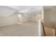 The bonus room includes neutral carpet, a ceiling fan, and two doorways at 205 Purslane Dr, Franklinton, NC 27525