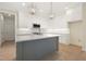 Kitchen featuring an island with seating, stylish pendant lights, and stainless appliances at 205 Purslane Dr, Franklinton, NC 27525