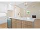 Kitchen with island, stainless steel appliances, and adjacent living area with fireplace at 205 Purslane Dr, Franklinton, NC 27525