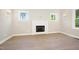 Bright living room features a fireplace, recessed lighting, and stylish flooring at 205 Purslane Dr, Franklinton, NC 27525