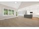 Open-concept living space with vaulted ceilings, hardwood floors, and modern kitchen at 205 Purslane Dr, Franklinton, NC 27525