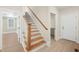 View of an open staircase in a home with hardwood flooring at 205 Purslane Dr, Franklinton, NC 27525