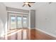 Sun-filled bedroom features hardwood floors and glass doors to balcony at 222 Glenwood Ave # 508, Raleigh, NC 27603