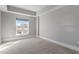 Neutral bedroom with one window, carpet flooring, and base molding at 222 Glenwood Ave # 508, Raleigh, NC 27603