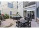 Outdoor courtyard with comfortable seating, dining tables, and string lights for evening ambiance at 222 Glenwood Ave # 508, Raleigh, NC 27603