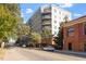 Multi-story apartment building showcasing a modern facade, private balconies, and street parking at 222 Glenwood Ave # 508, Raleigh, NC 27603