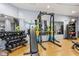 Well equipped gym with free weights, squat rack, bench and mirrors to aid in training at 222 Glenwood Ave # 508, Raleigh, NC 27603